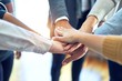 © Krakenimages.com - Group of business workers standing with hands together at the office