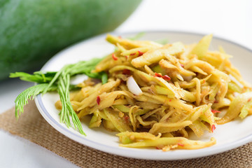 Thai food, spicy green mango salad (Tum Ma Muang)