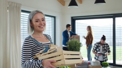 Wall Mural - Group of young people moving in new home, house sharing concept.