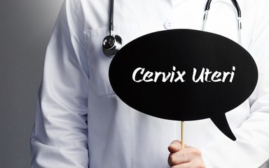 Cervix Uteri. Doctor in smock holds up speech bubble. The term Cervix Uteri is in the sign. Symbol of illness, health, medicine