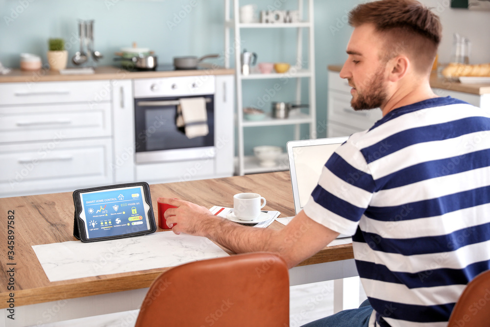 Man using application of smart home automation