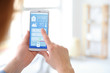 © Pixel-Shot - Woman using application of smart home automation