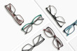 © giryakson - Composition of many different classic style glasses on white square stands.