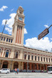 Luz Station in San Paulo.  View from Parque da Luz.  Building with a tower in front of Blue sky. Brazil.