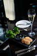 Black caviar served with blinis and champagne in the luxury restaurant