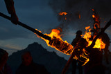 Fototapeta  - Detail of the flames of burning torches at the Nowruz / Novruz celebration near the city of Akre in Kurdish Iraq, a local tradition, men carry burning torches to the top of the mountains.