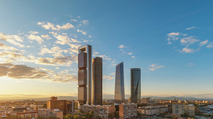 Madrid Spain, sunset city skyline at financial district center with four towers