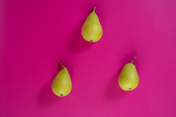 green pears on background