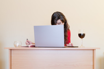 young woman working on laptop