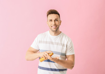 Sticker - Handsome young man with shampoo on color background