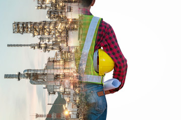 Wall Mural - Refinery industry engineer  wearing PPE Working at refinery construction site