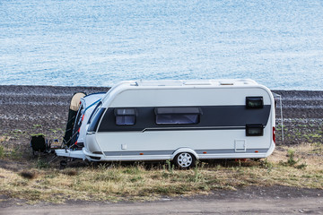 Wall Mural - Camper trailer by the sea near the lagoon