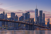 Sunset Time Cityscape Manhattan.A Lot Of Business Buildings In Line.Light Of The City It Turn On. Color Sky Very Awesome. Point View From Dumbo Brooklyn. Selective Focus.