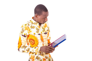 Poster - young serious businessman looking at his document.