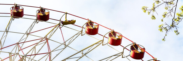 part of red circle attraction in amusement public park outdoor