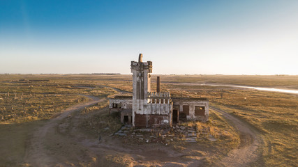 Canvas Print - Old abandoned slaughterhouse in Epecuen ghost town. Designed by architect Francisco Salamone. The sign next to the tower is slaughterhouse in spanish