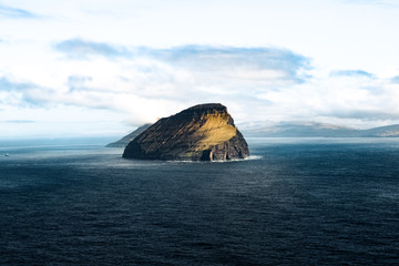 faroe islands, koltur. majestic island being constantly lashed by wind and waves.