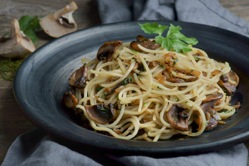 Wall Mural - spaghetti with mushrooms on a dark background