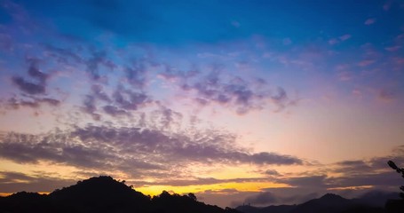 Canvas Print - Timelapse of beautiful sunrise over mountains with dramatic sky and colorful clouds. 4K time lapse clip