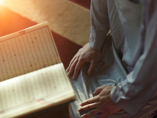 Wall Mural - muslim man praying inside the mosque