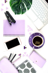 Canvas Print - Desktop workspace flat lay with hi-tech touch screen laptop and modern purple, black and white accessories on white background. Vertical orientation.