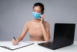 © Worranan - Asia woman working from home during coronavirus outbreak