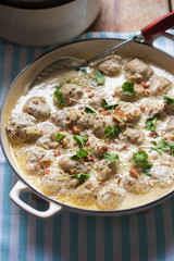 Wall Mural - Pork meatballs with almonds in mustard cream sauce 