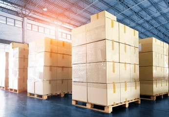 Wall Mural - Packaging Boxes Stacked on Pallets in Storage Warehouse. Cartons Cardboard Boxes. Supply Chain. Storehouse Distribution. Shipping Supplies Warehouse Logistics.	