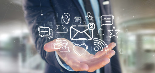 businessman holding a cloud of social media network icon