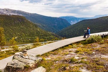 Canvas Print - Woman on Vedahaugane rest stop, Norway