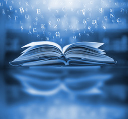 Poster - 	
The concept of education by planting a tree of knowledge in the opening of an old book in the library and the magical magic of light that flies to the destination of success. Beautiful background