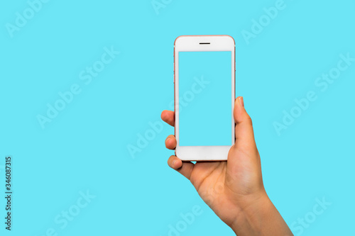 Fotografía Hand woman holding smartphone with blank screen isolated on colorful background