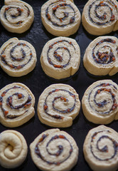 Wall Mural - Homemade sweet traditional dessert, pastry snails on baking tray