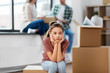 © Syda Productions - mortgage, family and real estate concept - sad girl moving to new home with mother and father packing things