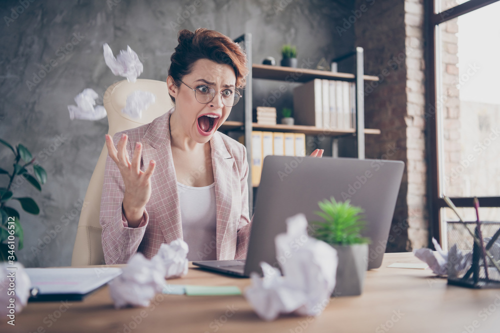 Close-up portrait of nice attractive crazy outraged lady ceo boss chief throwing documents screaming looking at screen at modern industrial concrete wall brick style interior workplace workstation - obrazy, fototapety, plakaty 