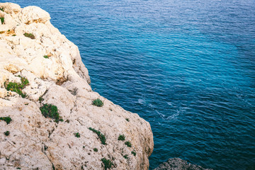 Wall Mural - White rocks and blue sea, minimalistic sea background and texture, abstract background. Cave Greco