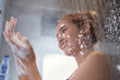 © torwaiphoto - Asian woman Enjoying the shower and rubbing soap She feels relaxed