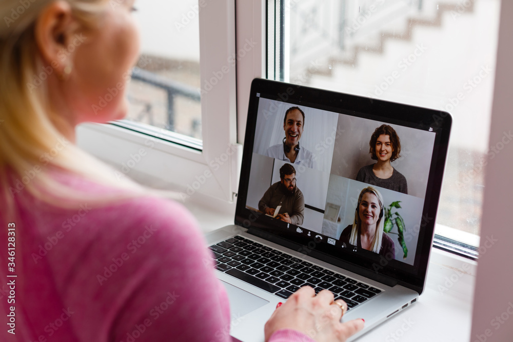 Woman Working From Home Having Group Videoconference On Laptop - obrazy, fototapety, plakaty 