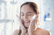 © torwaiphoto - Asian woman use foam to wash your face after showering.