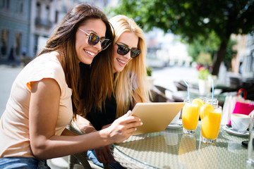 Wall Mural - Group of girl friends meeting for coffee and talk