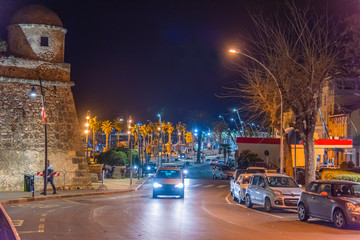 Wall Mural - Traffic in Alghero sea front at night