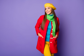 Sticker - Photo of attractive pretty lady look side empty space shopping prices banner advert wear yellow beret blue turtleneck green scarf red long coat pants isolated purple color background