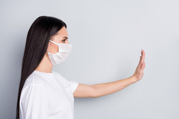 Sticker - Close-up profile side view portrait of nice attractive serious straight-haired girl showing stop sign solution health quarantine contact contamination isolated on light grey pastel color background