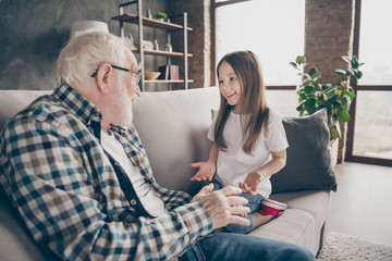 Photo of two people old grandpa little granddaughter sitting comfort sofa telling news secrets stay home house quarantine safety modern design living room indoors