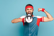 © LIGHTFIELD STUDIOS - emotional stylish sportsman with loudspeaker showing muscles on blue background