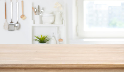 Wooden texture table top on blurred kitchen window background