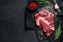 Raw Beef Fillet Steak. Organic Farm Meat. Black Background.