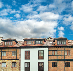 Facade of ancient house in a cloudy day