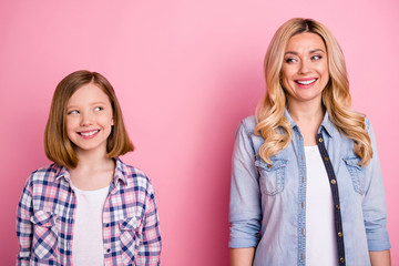 Poster - Portrait of candid charming mother and her daughter woman kid look each other enjoy wear denim jeans checkered plaid shirt isolated over pastel color background