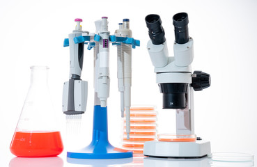 Canvas Print - microscope, petri dishes and pipette stand by microbiological laboratory